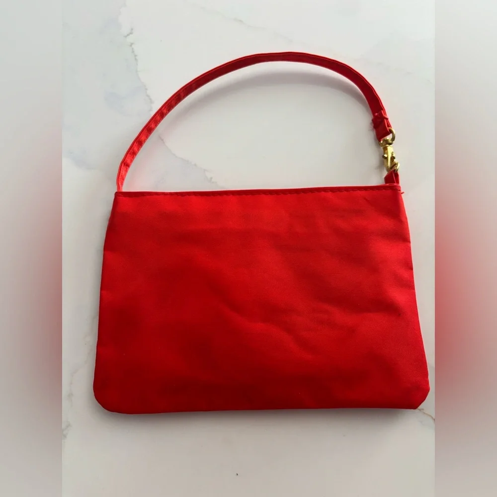 Kate Spade red nylon pouch with pink 